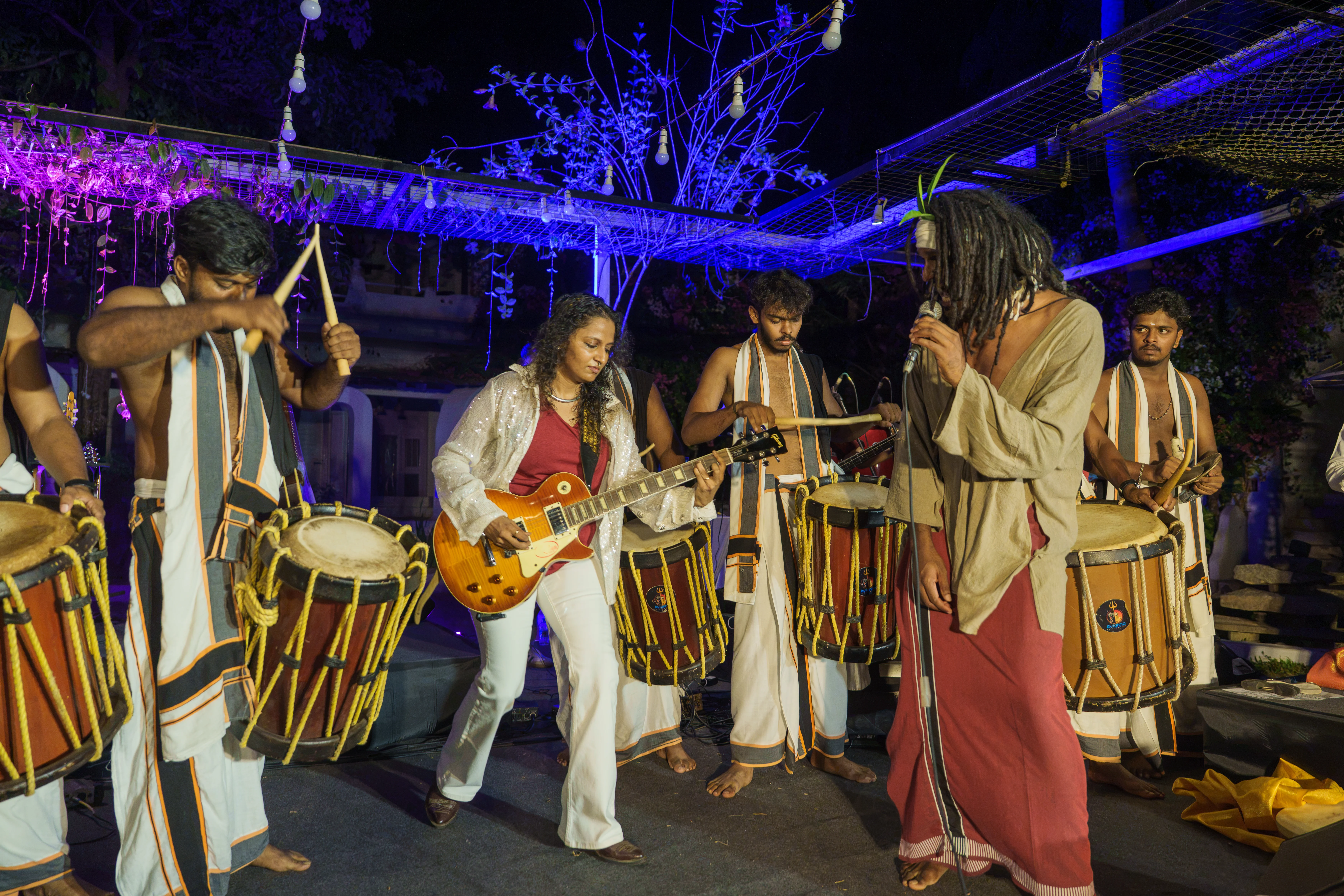 Performance moment with percussion and guitar