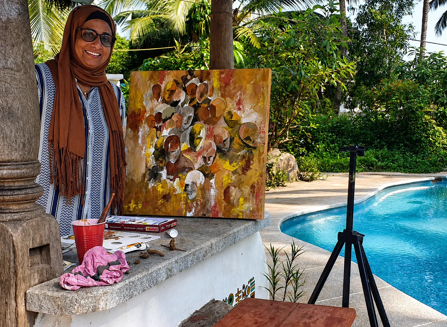 Female artist w. her work