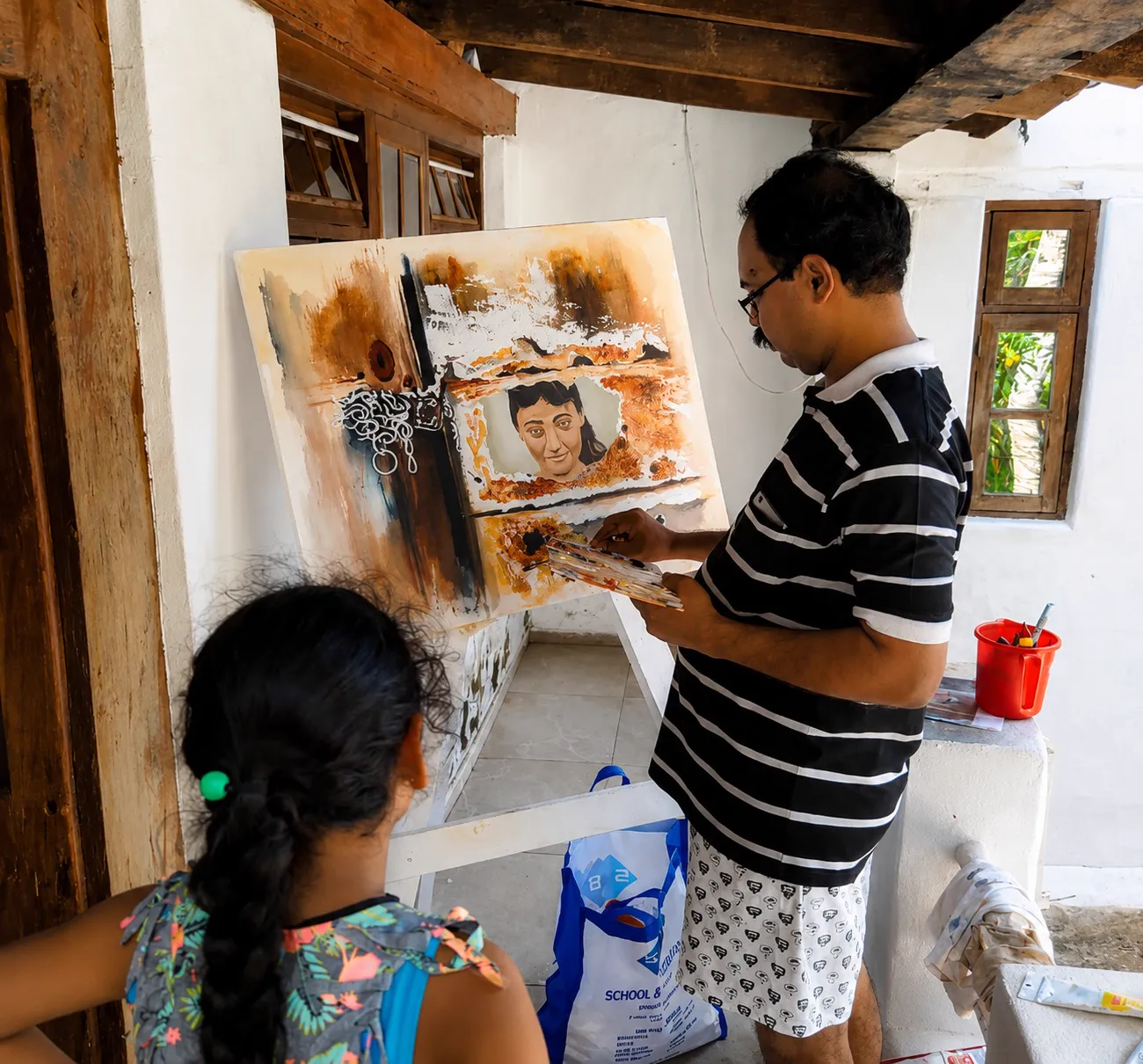 Artist w. their work