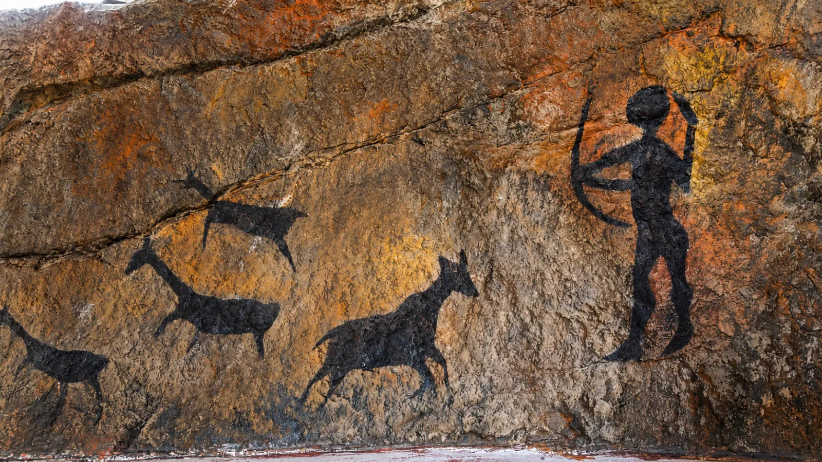 Rock art of caveman hunting deer